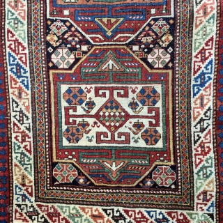 Shirvan Runner Last Quarter 19 Century: 3'3" x 8'9"

This exciting antique Caucasian runner of Shirvan design is characterized by expertly detail work, and an exciting treatment of color, from the stacked medallion  ...