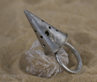 Old Berber pure silver, hand made,  conic ring from Morocco, Anti-Atlas region.

size: ring diameter: 2,0 cm 

conic height: 3,0 cm

weight gr. 50          