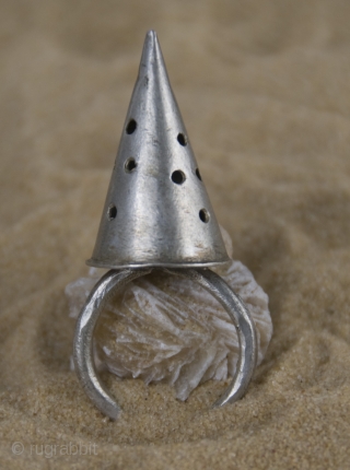 Old Berber pure silver, hand made,  conic ring from Morocco, Anti-Atlas region.

size: ring diameter: 2,0 cm 

conic height: 3,0 cm

weight gr. 50          