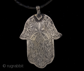 Old Berber pure silver Hamsa or Fatima's Hand, hand made amulet from Morocco, High Atlas region.
The hamsa (Arabic: خمسة ‎, khamsa, lit. five, also romanized khamsa and chamsa) is a palm-shaped amulet  ...