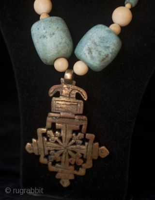 Old bronze Lalibela Coptic Cross from Ethiopia pendant insered on big old amazonite beads from Sahara, contemporary ivory and blue dutch. 

Cross Size: 9 cm x  6 CM

diameter of beads: 3  ...