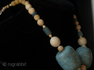 Old bronze Lalibela Coptic Cross from Ethiopia pendant insered on big old amazonite beads from Sahara, contemporary ivory and blue dutch. 

Cross Size: 9 cm x  6 CM

diameter of beads: 3  ...