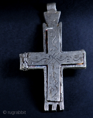 OLD COPTIC CROSS WITH ICON INSIDE

Old big silver metal Coptic cross amulet with painted icon inside. From Ethiopia

SIZE: 13 cm x 7 cm          