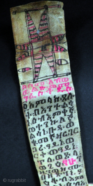 OLD COPTIC GE'EZ ILLUSTRATED SCROLL

Old long leather Coptic scroll written in Ge'ez language with painting. From Ethiopia

SIZE: 169 cm x  4,5 cm          