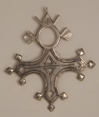 Bartchakea Tuareg Cross,  silver hand made amulet from Niger, region of Bartchakea. On the back side a sign represents artisan signature
Tuareg crosses are mostly worn by men and they are handed  ...