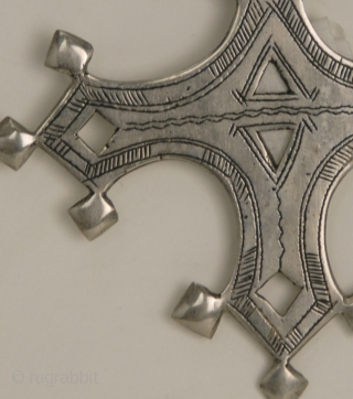 Bartchakea Tuareg Cross,  silver hand made amulet from Niger, region of Bartchakea. On the back side a sign represents artisan signature
Tuareg crosses are mostly worn by men and they are handed  ...