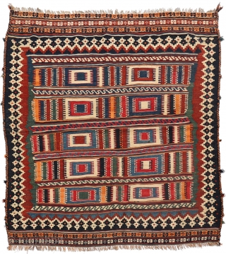 A squarish Qashqai kilim with square motifs! All natural dyes, including a nice emerald green and deep blue. You can buy this kilim directly from our web: https://nomada.biz/en/producto/semi-antique-qashqai-kilim-from-iran-145x129-cms/     