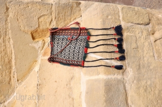 This antique Qashqai chanteh is woven with extremelly finelly spun wool. It has a metal buckle. All natural dyes. The tassels are not original but can easily be removed from the bag.  ...