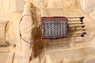 This antique Qashqai chanteh is woven with extremelly finelly spun wool. It has a metal buckle. All natural dyes. The tassels are not original but can easily be removed from the bag.  ...