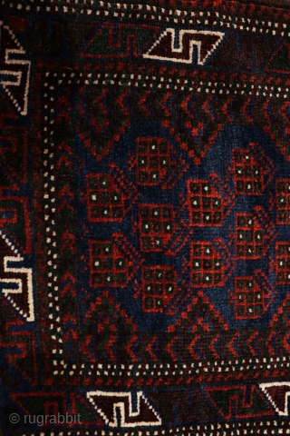 This antique balisht or cushion was woven by a woman from the Baluch tribe of Afghanistan. The wool is soft and silky and the dyes are natural. The central field is filled  ...