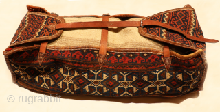 This antique Qashqai mafrash has been woven using only natural dyes. In mint condition. It is slightly smaller than the average Qashqai mafrash. We find this mafrash fascinating, since the back of  ...