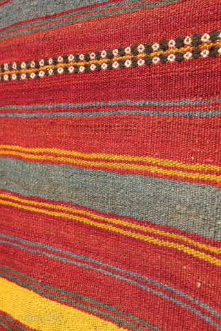 An antique kilim woven by an Uzbek weaver from Northern Afghanistan. The harmonious composition is achieved through the combination of wide plain bands with narrower bands decorated with small floral motifs, their  ...
