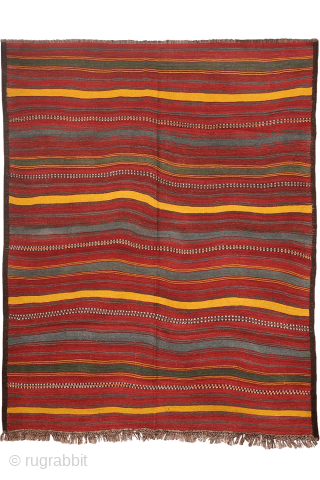 An antique kilim woven by an Uzbek weaver from Northern Afghanistan. The harmonious composition is achieved through the combination of wide plain bands with narrower bands decorated with small floral motifs, their  ...