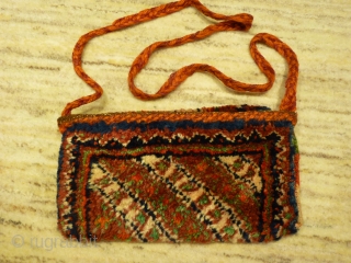 Arabic nomads (southern Iran) tobacco or money pouch, 24x12cms, woven in one piece with thick soft wool pile, from about 1940.            