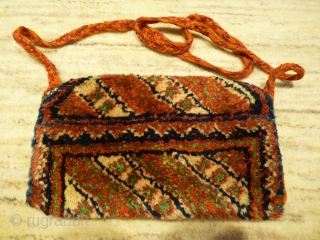 Arabic nomads (southern Iran) tobacco or money pouch, 24x12cms, woven in one piece with thick soft wool pile, from about 1940.            