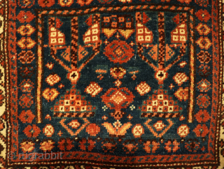 This antique chanteh or bag from the Qashqai tribe of Iran has a very unusual design. All dyes are natural. On the back of the kilim there is some staining.

You can buy  ...