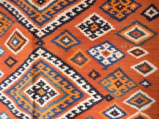  kilim from the beggining of the 20th century in mint condition, including the fringe area. All dyes are natural and for the background of the central field, a terracotta hue has  ...