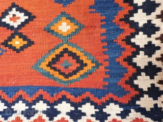  kilim from the beggining of the 20th century in mint condition, including the fringe area. All dyes are natural and for the background of the central field, a terracotta hue has  ...