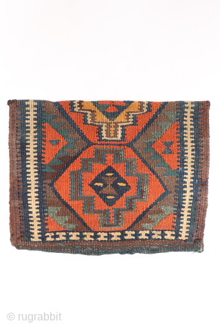 A rare Kurdish bag that has been opened out. This chanteh originally was folded in halve resulting in a square bag. The rectangular long and narrow strip was used to close the  ...