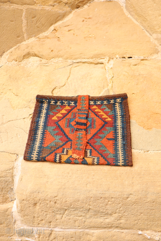 A rare Kurdish bag that has been opened out. This chanteh originally was folded in halve resulting in a square bag. The rectangular long and narrow strip was used to close the  ...