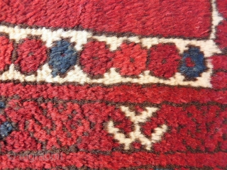 A soft, glossy and shinny prayer rug woven by ethic Uzbeks in Afghanistan. The 11 güls in the field are framed by a hooked Mihrab. The little "flowers" in the two white  ...