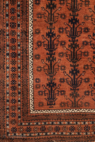 A finely woven antique Baluch rug from the Sistan area of Afghanistan, featuring a rare and charming design of a small plant or bush repeated across the entire field. With a very ...
