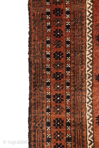 A finely woven antique Baluch rug from the Sistan area of Afghanistan, featuring a rare and charming design of a small plant or bush repeated across the entire field. With a very ...