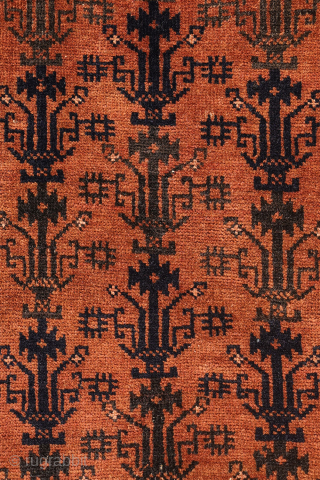 A finely woven antique Baluch rug from the Sistan area of Afghanistan, featuring a rare and charming design of a small plant or bush repeated across the entire field. With a very ...