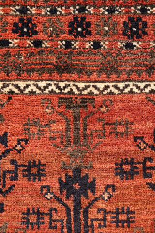 A finely woven antique Baluch rug from the Sistan area of Afghanistan, featuring a rare and charming design of a small plant or bush repeated across the entire field. With a very ...
