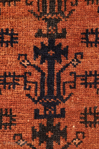 A finely woven antique Baluch rug from the Sistan area of Afghanistan, featuring a rare and charming design of a small plant or bush repeated across the entire field. With a very ...