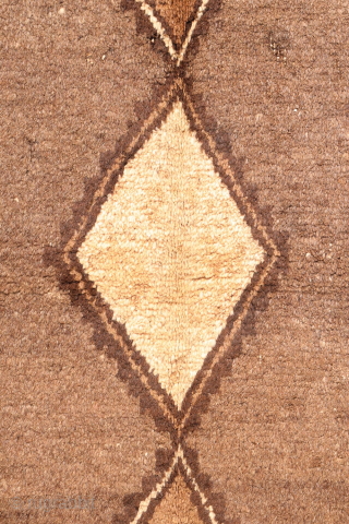 An unusual Qashqai gabbeh rug, likely woven with undyed natural camel wool. The rich color suggests the use of camel wool, and the weaver even included some camels in the design. Charming ...