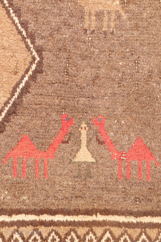 An unusual Qashqai gabbeh rug, likely woven with undyed natural camel wool. The rich color suggests the use of camel wool, and the weaver even included some camels in the design. Charming ...