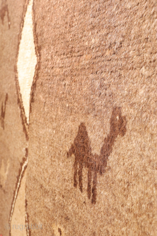 An unusual Qashqai gabbeh rug, likely woven with undyed natural camel wool. The rich color suggests the use of camel wool, and the weaver even included some camels in the design. Charming ...