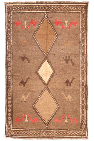 An unusual Qashqai gabbeh rug, likely woven with undyed natural camel wool. The rich color suggests the use of camel wool, and the weaver even included some camels in the design. Charming ...