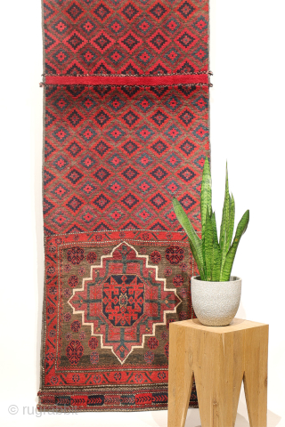 Rare  Baluch Runner from Iran – Design inspired by early Islamic architecture

This fascinating semi-antique Baluch runner from Iran features a rare and distinctive design. Originally crafted as a saddlebag, it has  ...