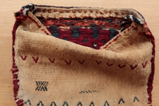 Small Qashqai mid century chanteh with soumak and floating weft embroidery onto warp faced cotton and wool ground, authentic used nomadic piece showing signs of wear consistent with age, 22cmx26cm.   