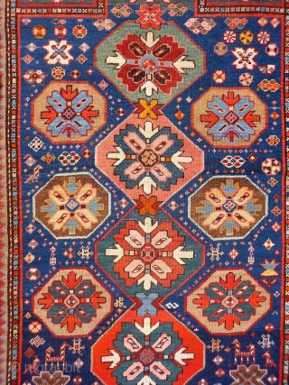 A Kuba rug with very vibrant natural colours and a nice design. The formality of the border and the mihrab contrasts with the introduction of animals and geometric floral motives throught the  ...