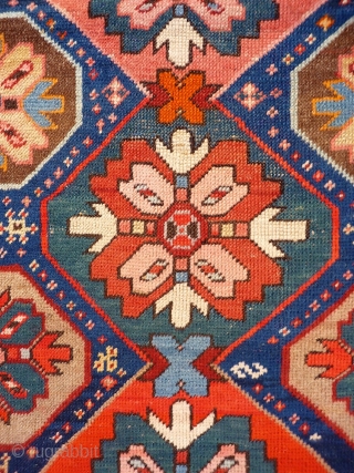 A Kuba rug with very vibrant natural colours and a nice design. The formality of the border and the mihrab contrasts with the introduction of animals and geometric floral motives throught the  ...