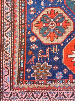 A Kuba rug with very vibrant natural colours and a nice design. The formality of the border and the mihrab contrasts with the introduction of animals and geometric floral motives throught the  ...