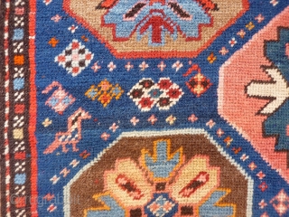 A Kuba rug with very vibrant natural colours and a nice design. The formality of the border and the mihrab contrasts with the introduction of animals and geometric floral motives throught the  ...