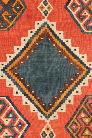 This stunning antique Persian Qashqai kilim showcases an impressive range of rich, natural colours, including indigo blue, mustard yellow, and warm terracotta—all achieved using 100% natural dyes.

Woven with exceptionally fine, hand-spun wool,  ...