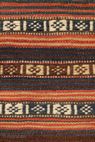 This stunning antique Persian Qashqai kilim showcases an impressive range of rich, natural colours, including indigo blue, mustard yellow, and warm terracotta—all achieved using 100% natural dyes.

Woven with exceptionally fine, hand-spun wool,  ...