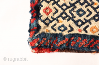 An antique little Qashqai bag that combines flatweave and knotted techniques.

https://www.nomada.biz/en/producto/antique-qashqai-chanteh-or-bag-from-iran-37x27-cms/                      