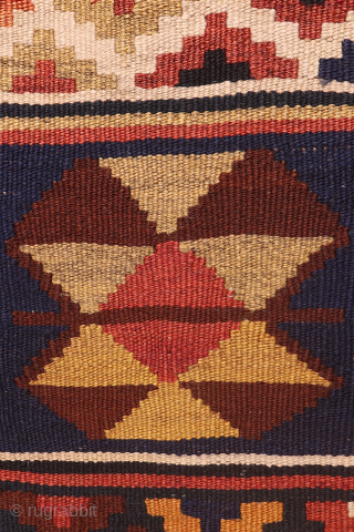 An antique Qashqai kilim woven with natural dyes. The design consists of motifs arranged in horizontal bands and combining multiple motifs. In both ends the kilim is finished with multiple borders. In  ...