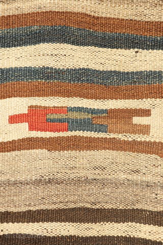This antique kilim from the Qashqai tribes of Iran is a beautiful example of intuitive weaving and artistic expression. Woven with a blend of dyed and undyed wool, its primary design features  ...