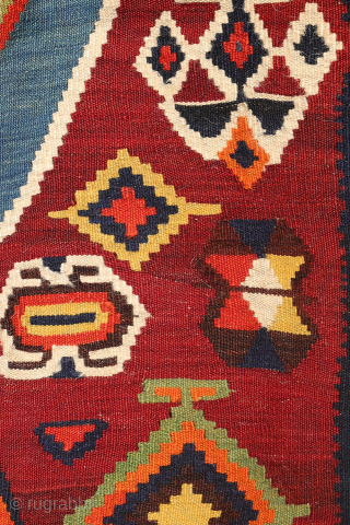 This highly collectible antique Qashqai kilim from Iran features a bold and captivating design. Made with top-quality natural dyes, it showcases rich, deeply saturated colors—including striking greens and blues—that sets it apart.

At  ...