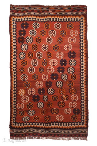 An antique Qashqai kilim woven with natural dyes. The wool is very finely spun. The pattern is arranged diagonally on a terracotta background with a beautiful abrash (colour changes). In mint condition.  ...