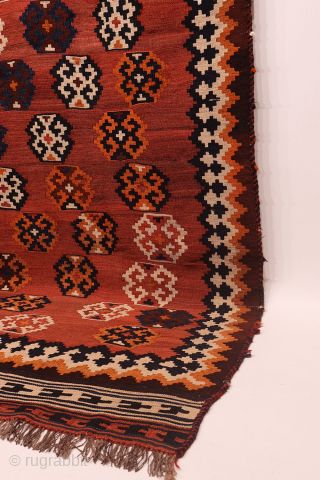An antique Qashqai kilim woven with natural dyes. The wool is very finely spun. The pattern is arranged diagonally on a terracotta background with a beautiful abrash (colour changes). In mint condition.  ...