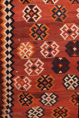 An antique Qashqai kilim woven with natural dyes. The wool is very finely spun. The pattern is arranged diagonally on a terracotta background with a beautiful abrash (colour changes). In mint condition.  ...