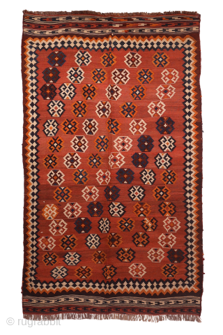 An antique Qashqai kilim woven with natural dyes. The wool is very finely spun. The pattern is arranged diagonally on a terracotta background with a beautiful abrash (colour changes). In mint condition.  ...